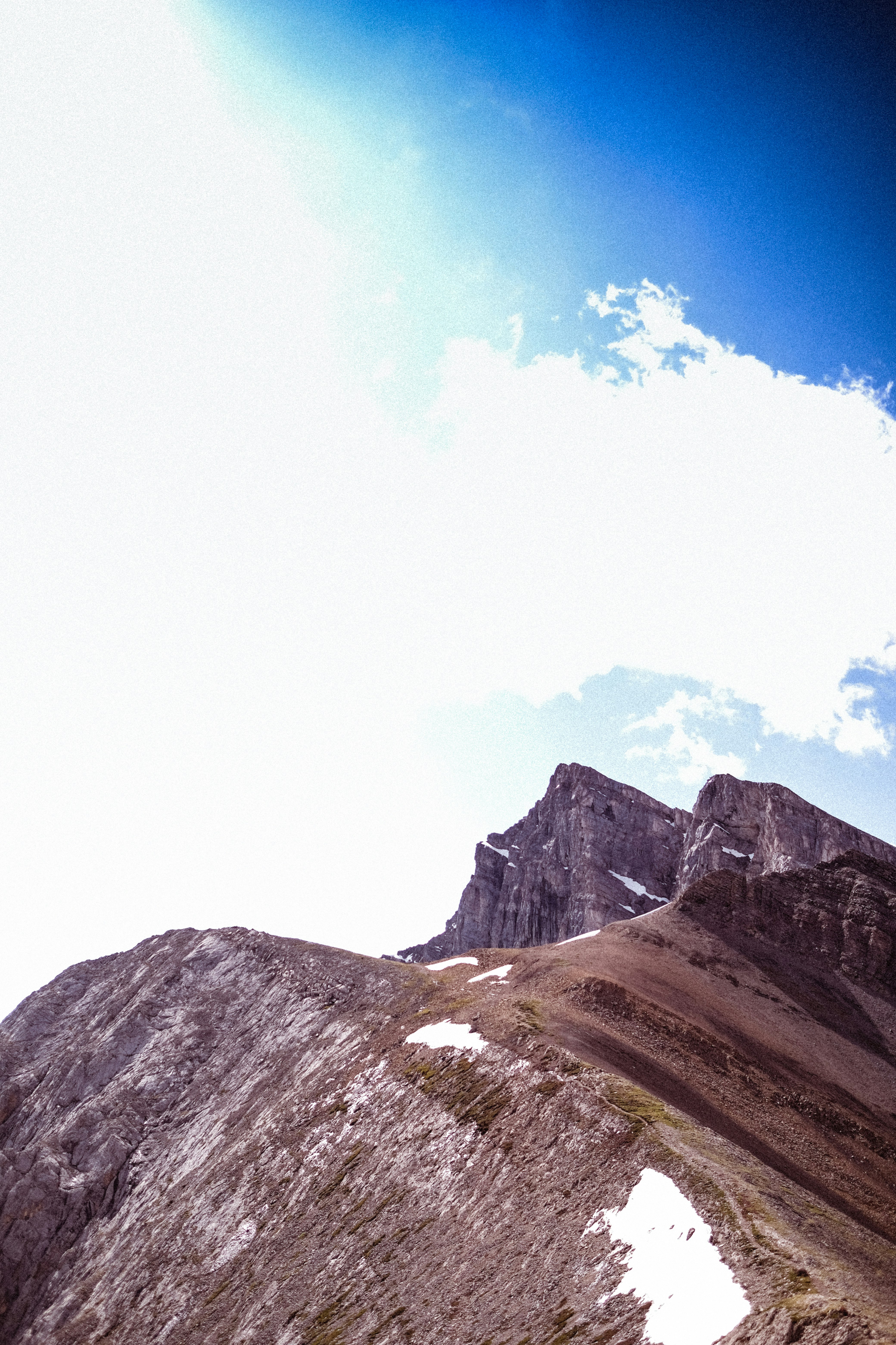 snow covered mountain under blue sky during daytime